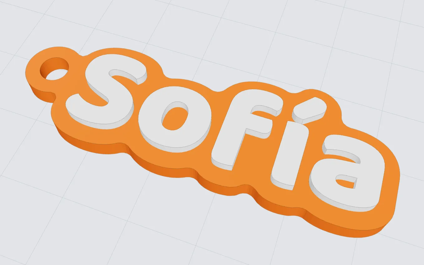 Llavero con el nombre Sofía en letras blancas sobre una base naranja, sobre la cama de la impresora.
